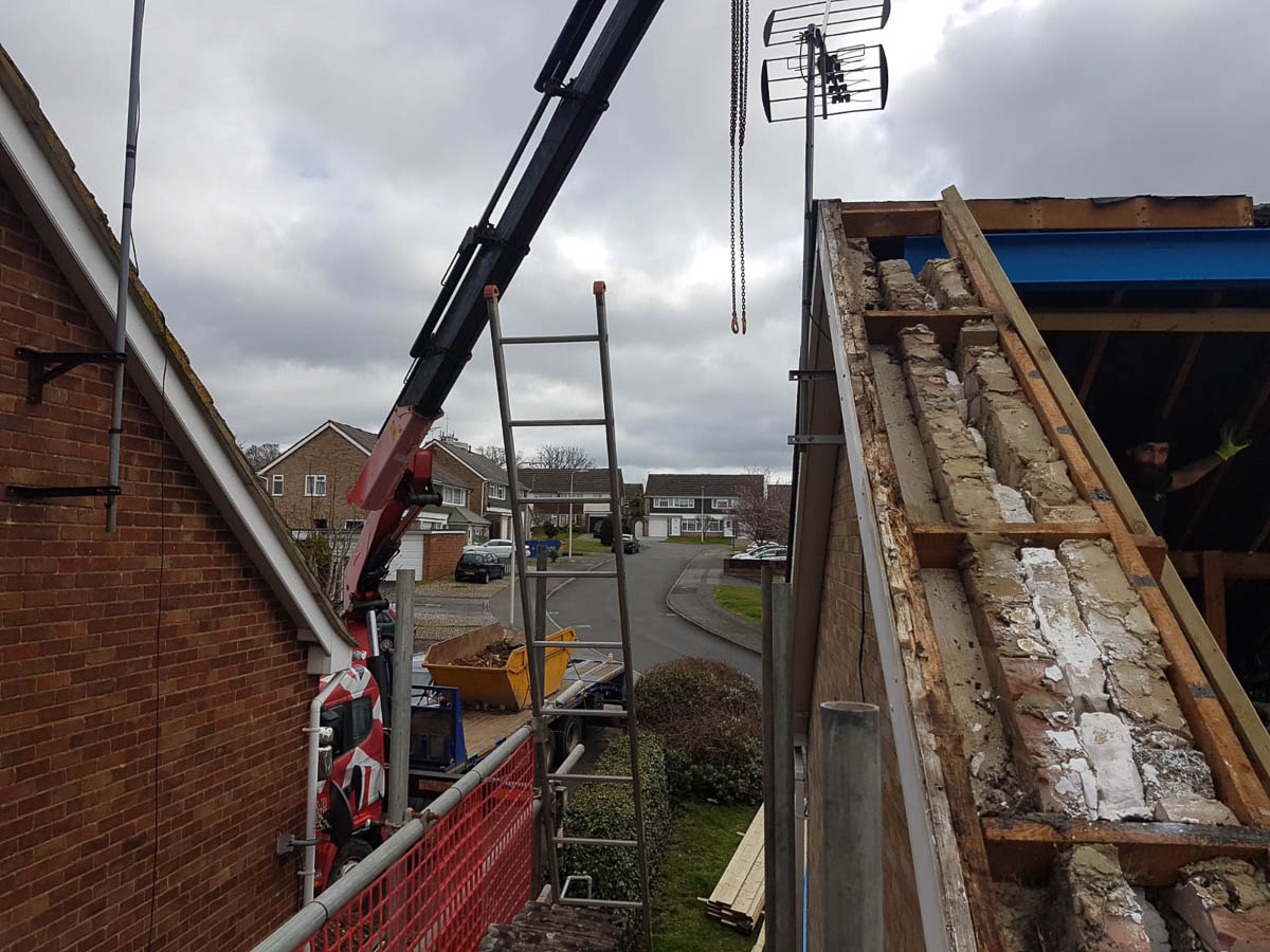 Beams being placed in house roof loft in Hertfordshire