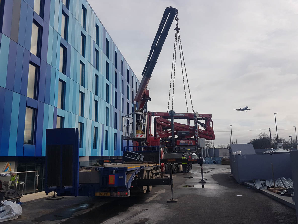 Working at Heathrow lifting machinery to lower level